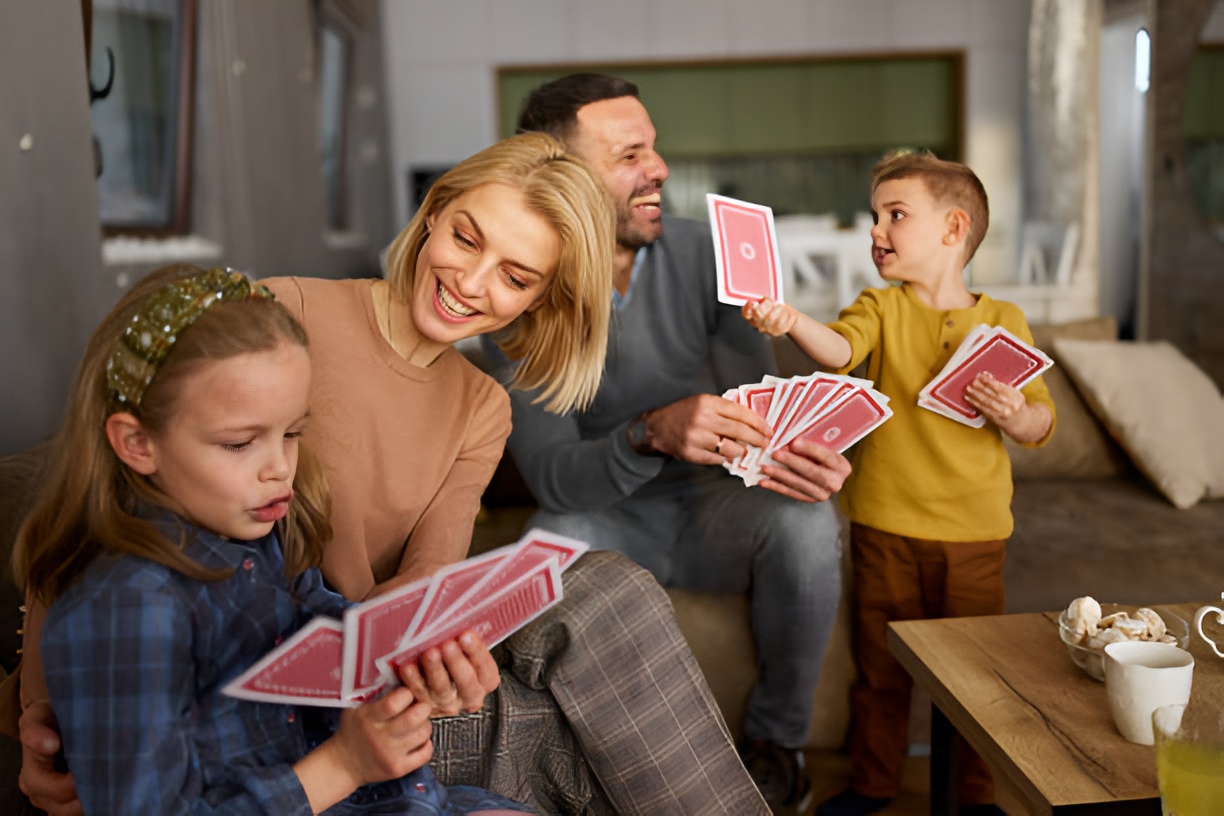 parents and kids using jumbo playing cards